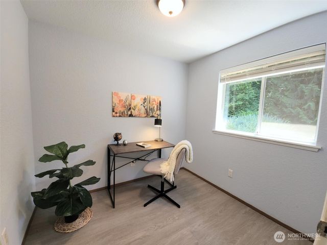 a workspace with furniture and a window