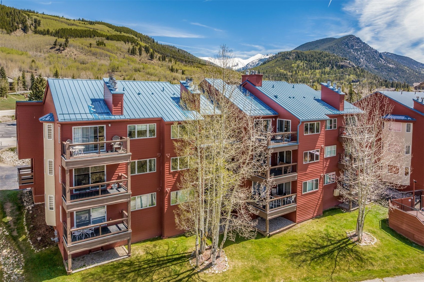 60 Oro Grande Road, Unit 204 Keystone, CO 80435 - Photo 38 of 50 a front view of a building with a garden and plants