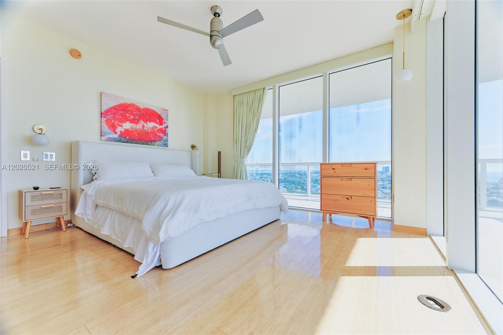 450 Alton Road, Unit 2810 Miami Beach, FL 33139 - Photo 10 of 29 a bedroom with a bed and a table in it