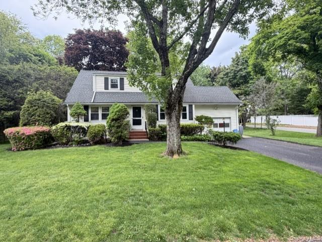 17 Mallory Road Spring Valley, NY 10977 - Photo 2 of 26 a front view of a house with a yard and trees