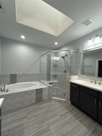 a bathroom with a bathtub and a sink