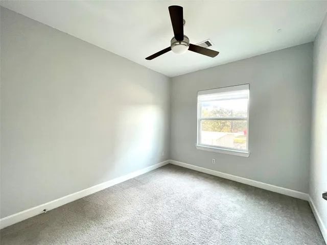a view of empty room with windows