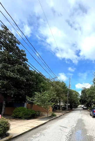 a view of street with parked cars