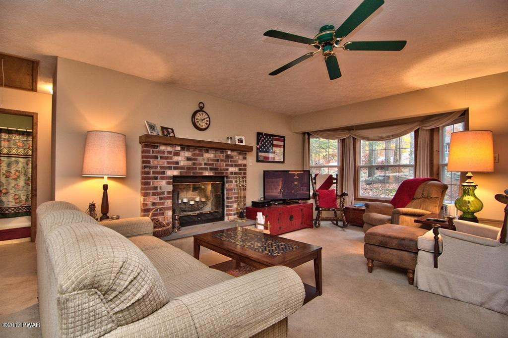 3296 Northgate Road Lake Ariel, PA 18436 - Photo 4 of 33 a living room with furniture fireplace and a large window