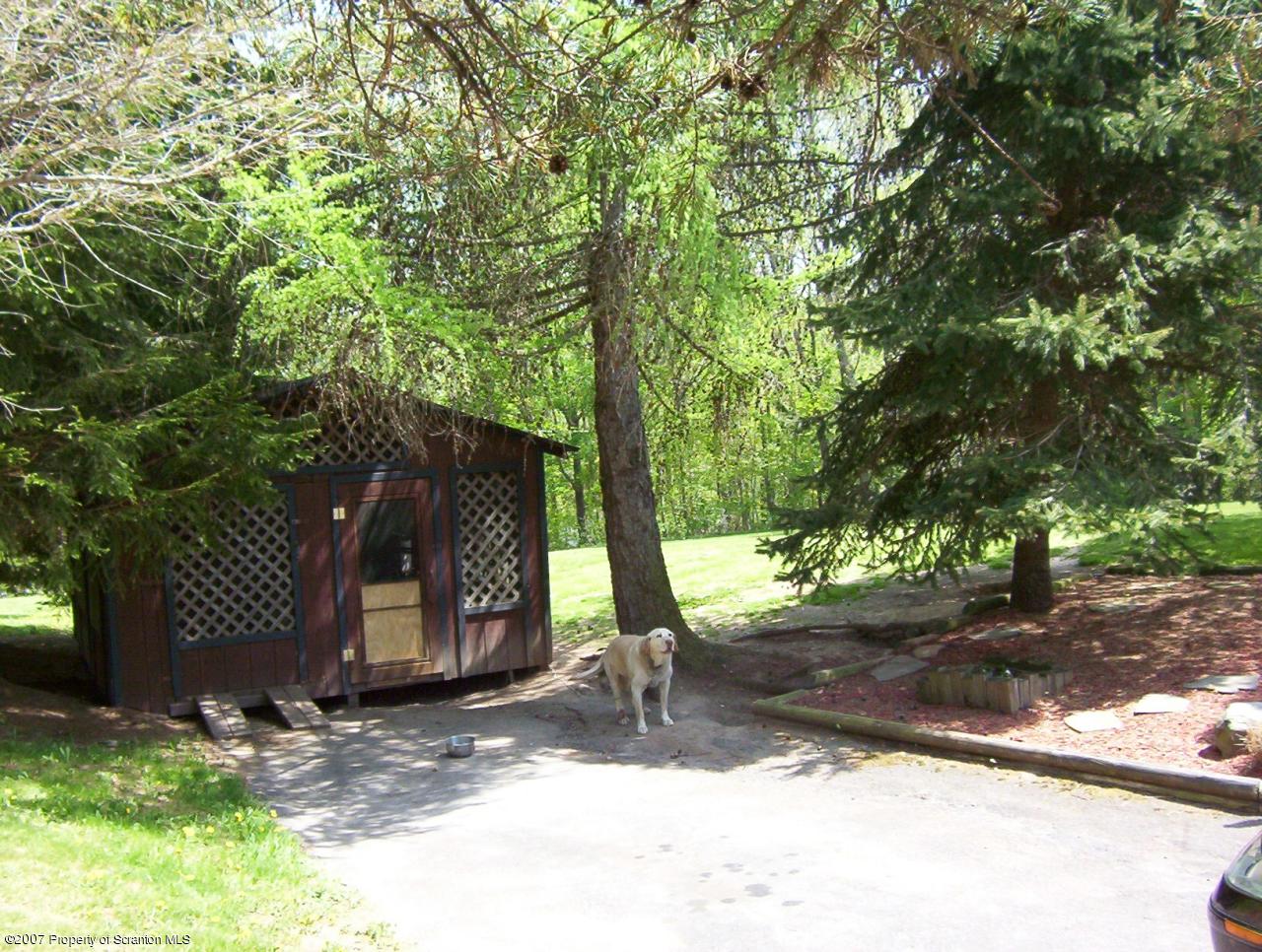4 Rr Road Lake Ariel, PA 18436 - Photo 2 of 12 a backyard of a house with table and chairs