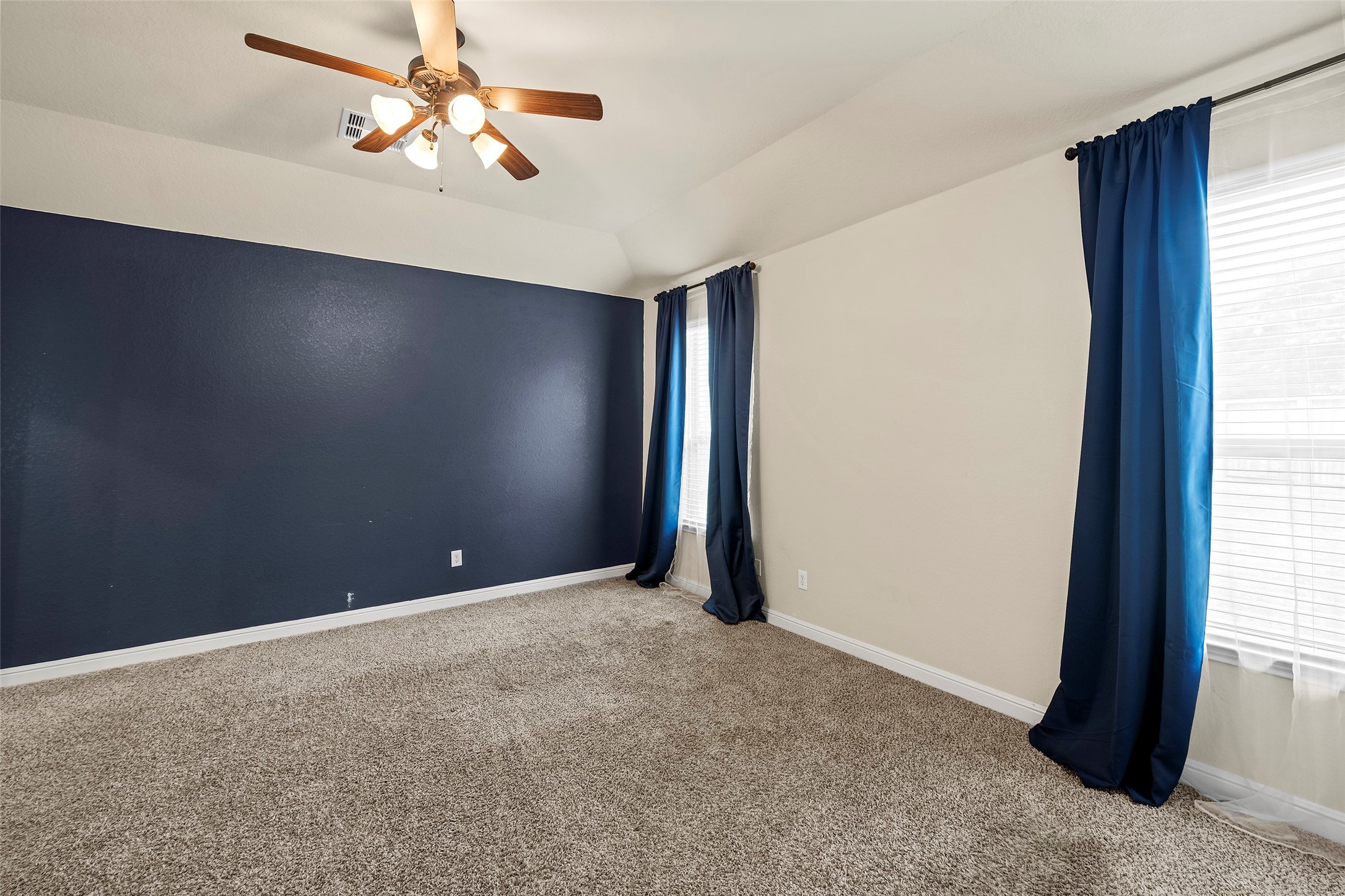 2703 Barrington Branch Drive Spring, TX 77373 - Photo 16 of 33 Navy blue accent wall and drapes
