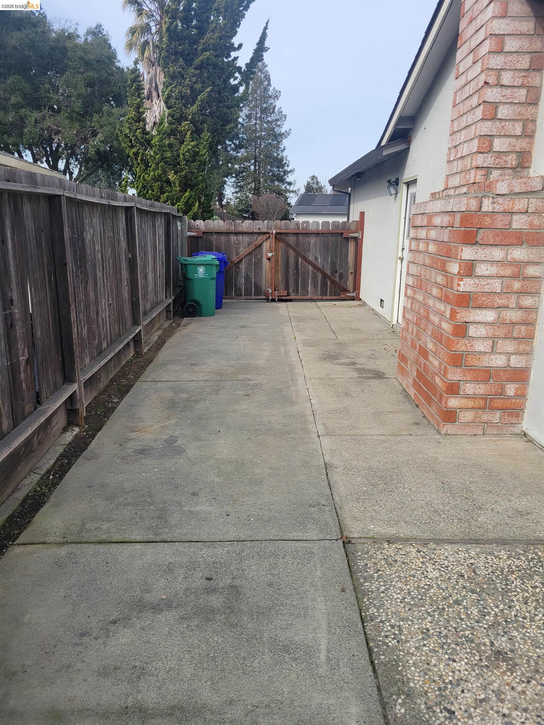 906 Coral Drive Rodeo, CA 94572 - Photo 16 of 21 a view of backyard with wooden fence