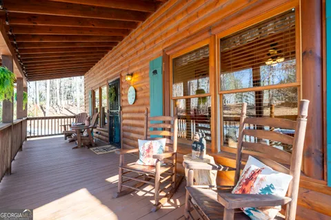 a outdoor living space with patio furniture and wooden floor