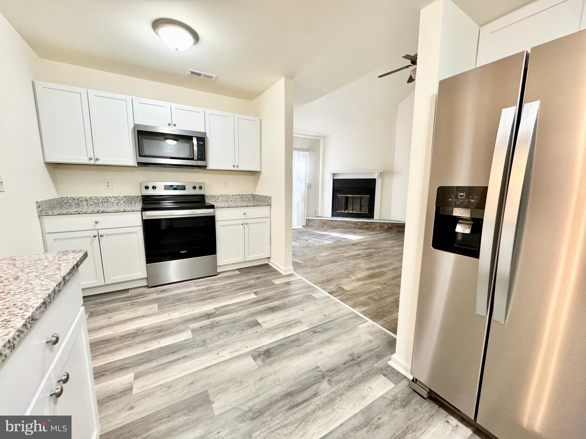 271 Pine Valley Road Dover, DE 19904 - Photo 12 of 24 a kitchen with stainless steel appliances granite countertop a refrigerator sink and stove