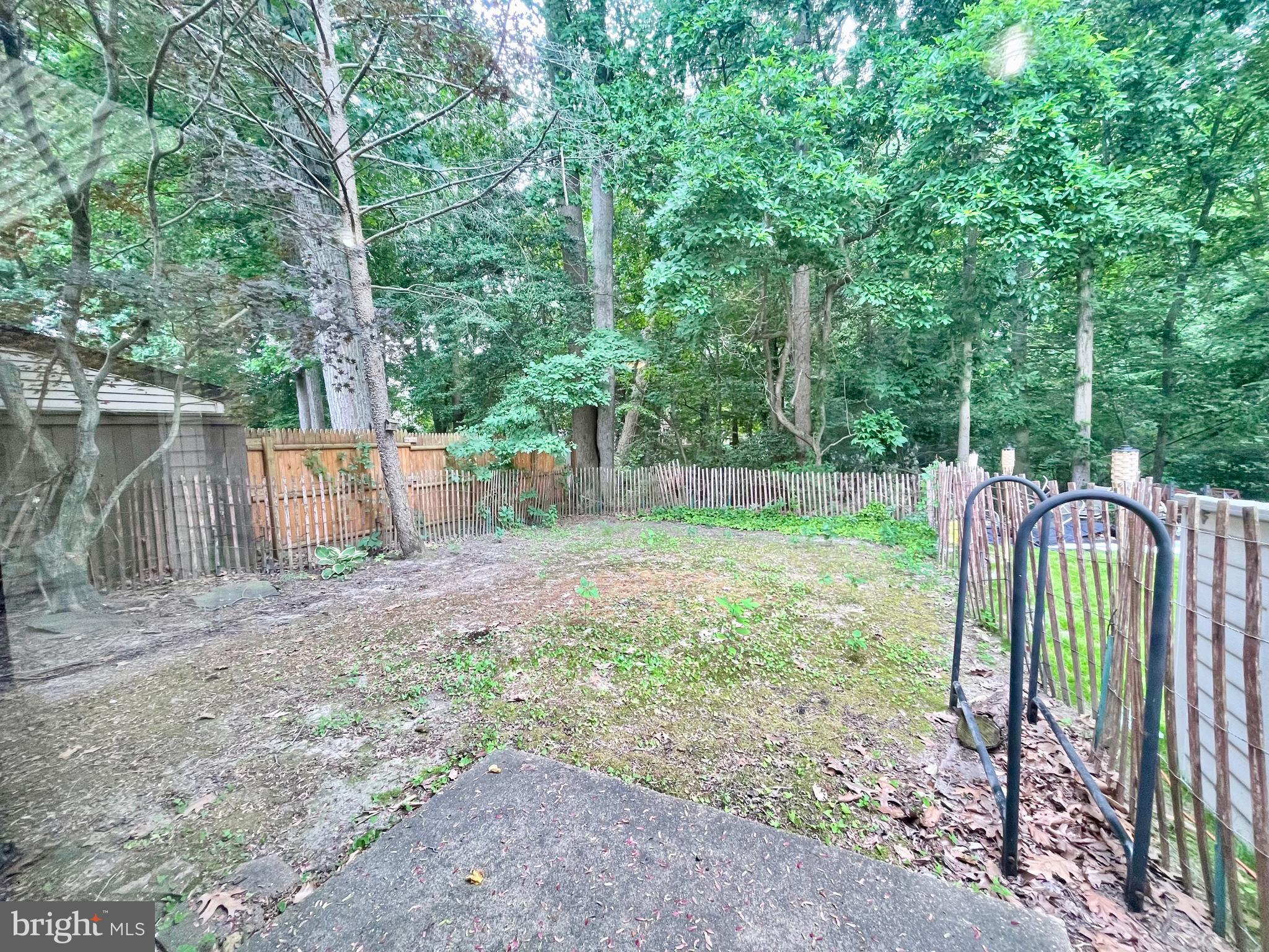271 Pine Valley Road Dover, DE 19904 - Photo 16 of 24 a backyard of a house with lots of green space and plants