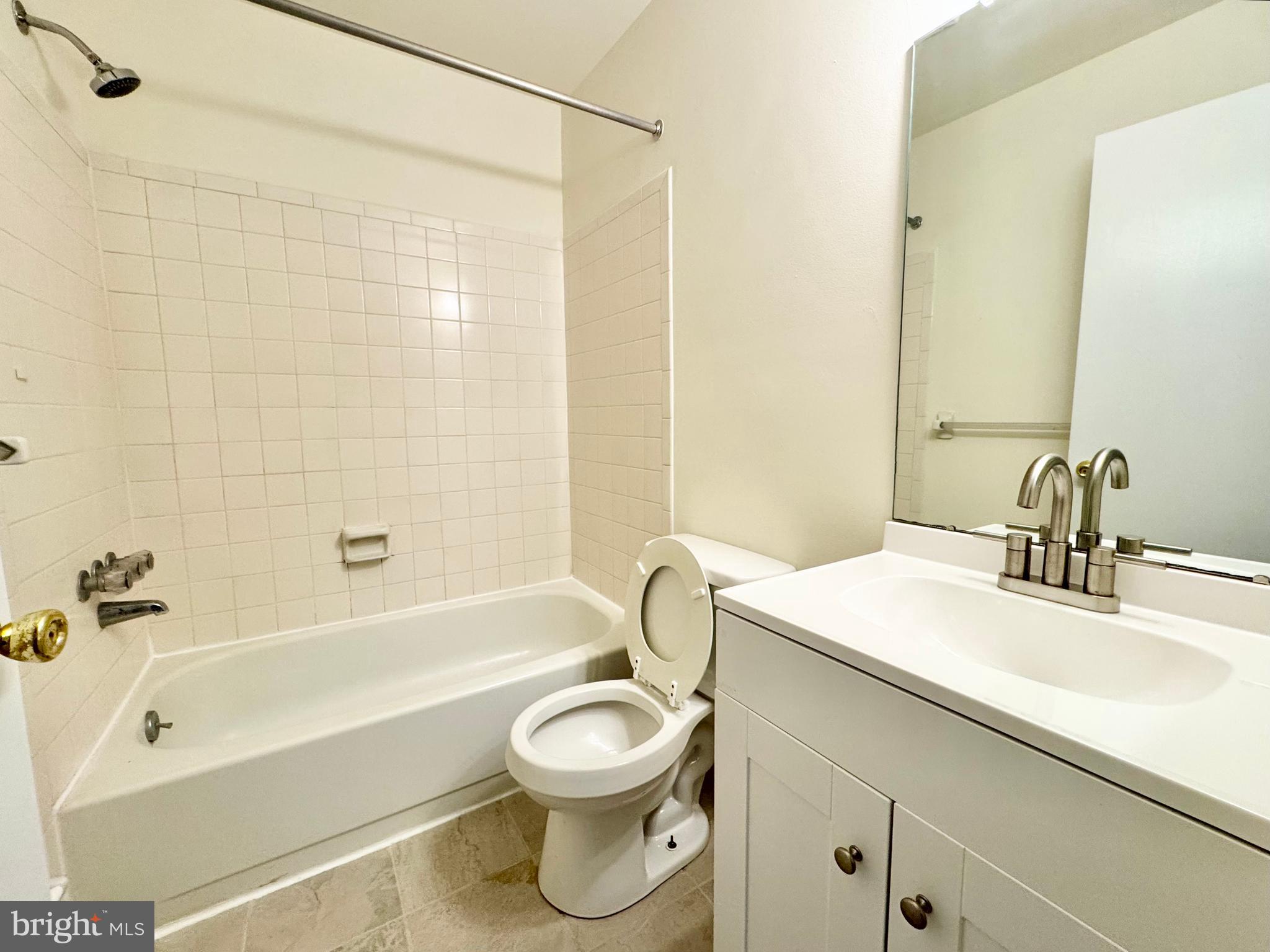 271 Pine Valley Road Dover, DE 19904 - Photo 24 of 24 a bathroom with a sink a toilet and a bathtub
