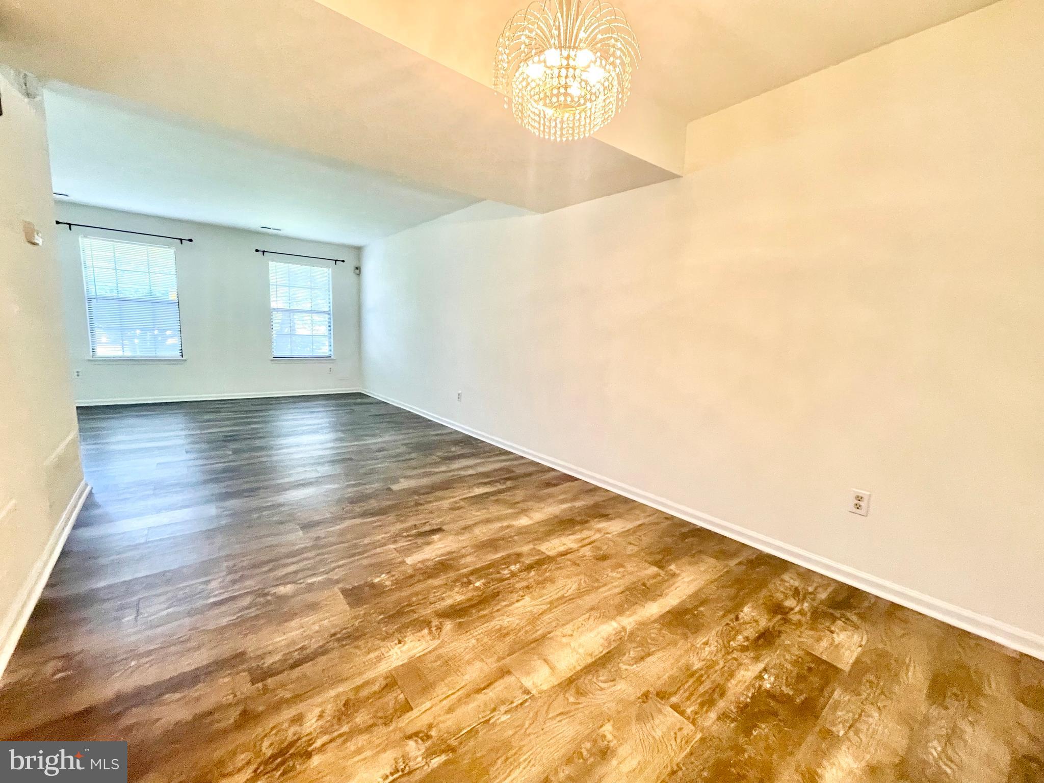 271 Pine Valley Road Dover, DE 19904 - Photo 7 of 24 an empty room with wooden floor