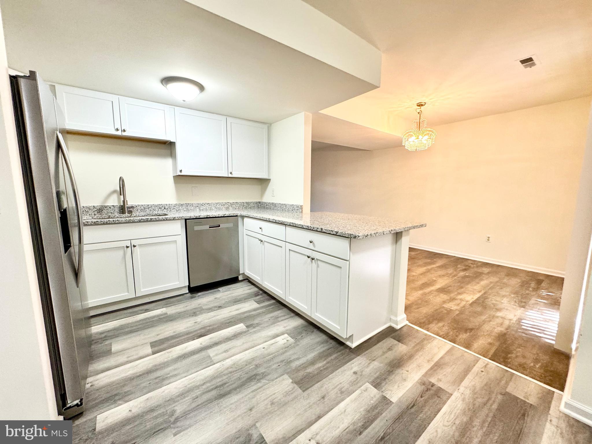 271 Pine Valley Road Dover, DE 19904 - Photo 9 of 24 a kitchen with a sink stove and cabinets