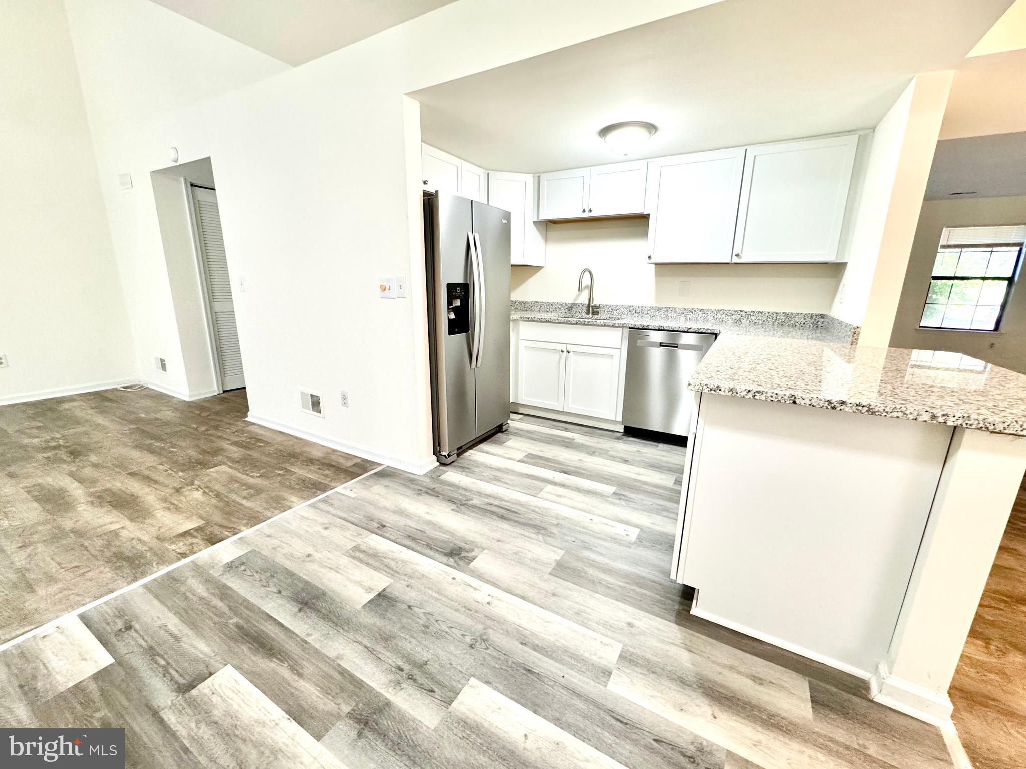 271 Pine Valley Road Dover, DE 19904 - Photo 10 of 24 a kitchen with granite countertop a sink stainless steel appliances and cabinets