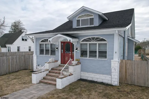 a front view of a house with garage