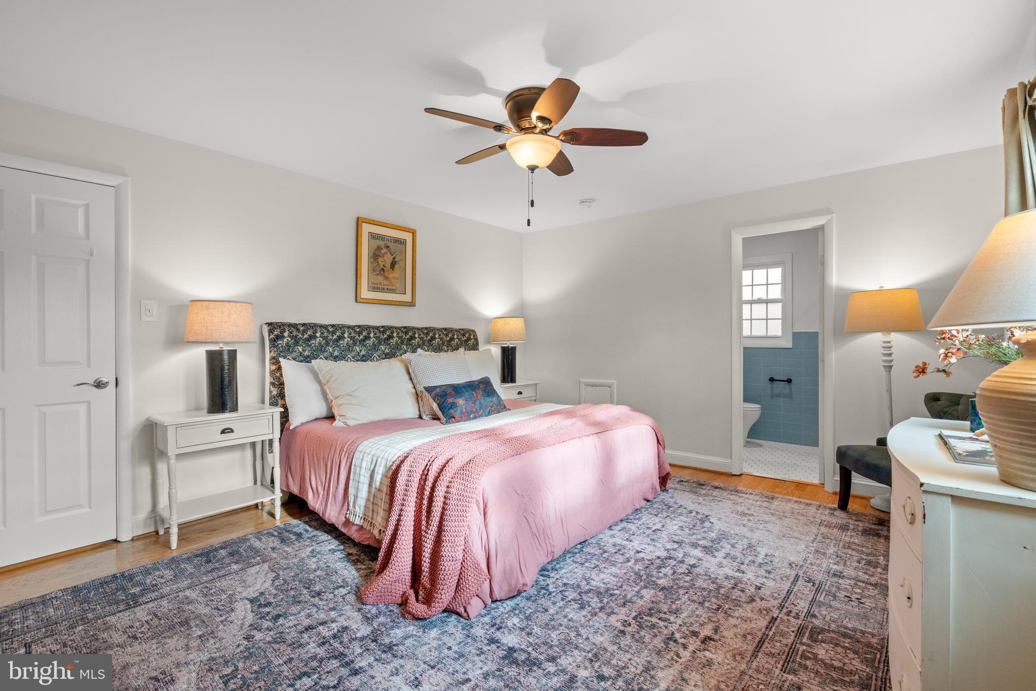 6219 Arkendale Road Alexandria, VA 22307 - Photo 17 of 33 a bedroom with a bed and a chandelier