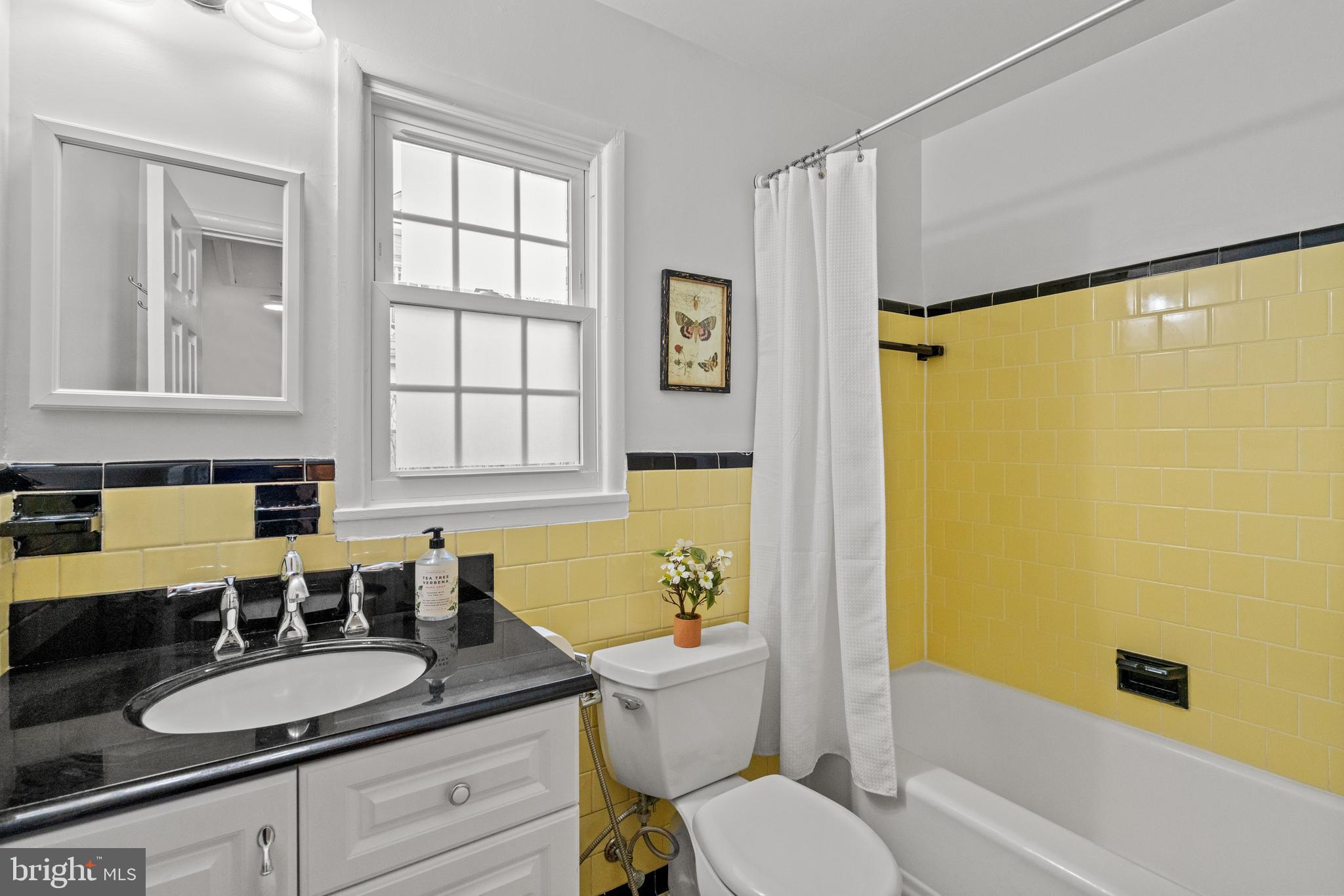 6219 Arkendale Road Alexandria, VA 22307 - Photo 23 of 33 a bathroom with a granite countertop sink toilet and shower