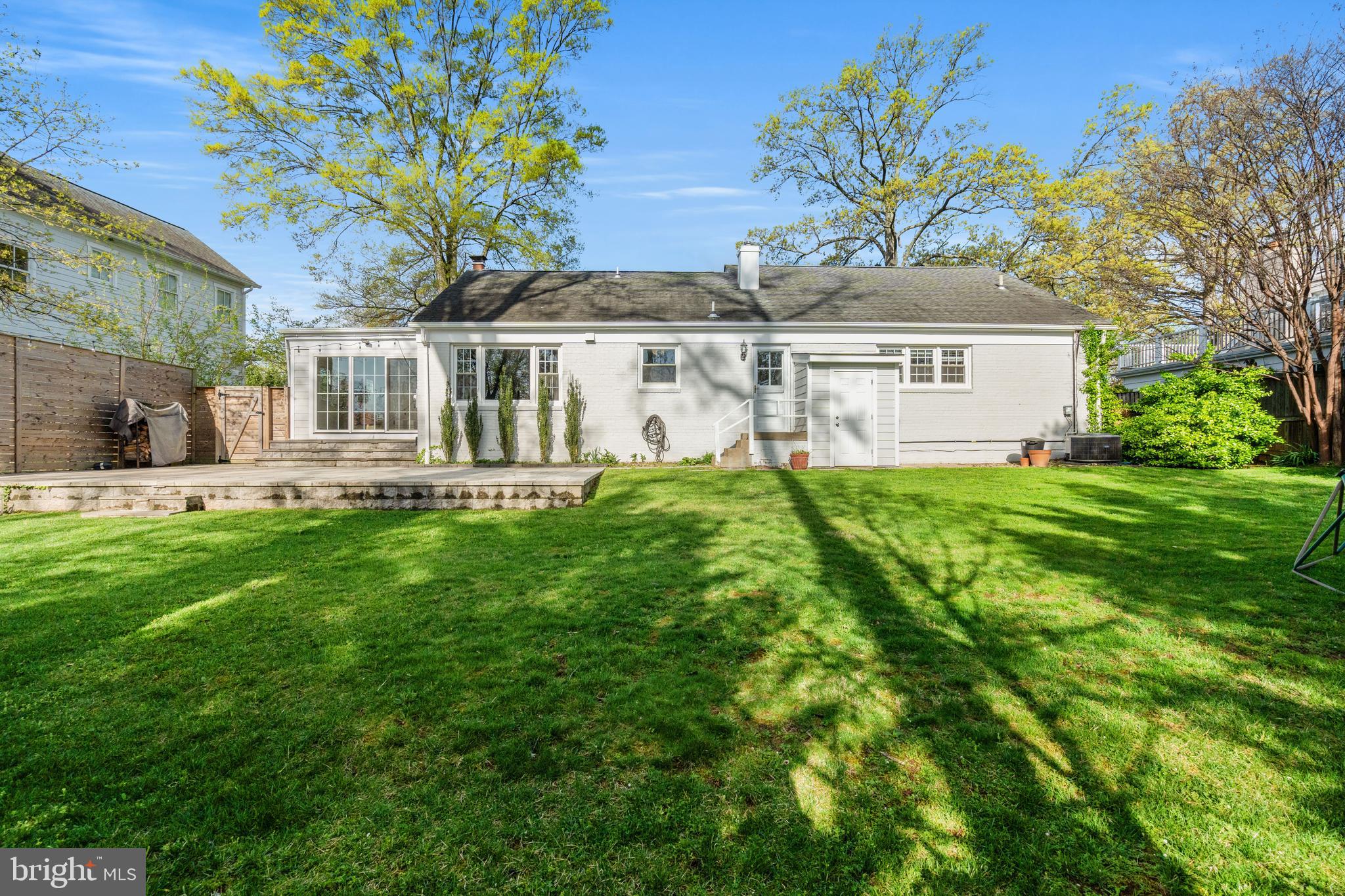 6219 Arkendale Road Alexandria, VA 22307 - Photo 32 of 33 a front view of a house with a yard table and chairs