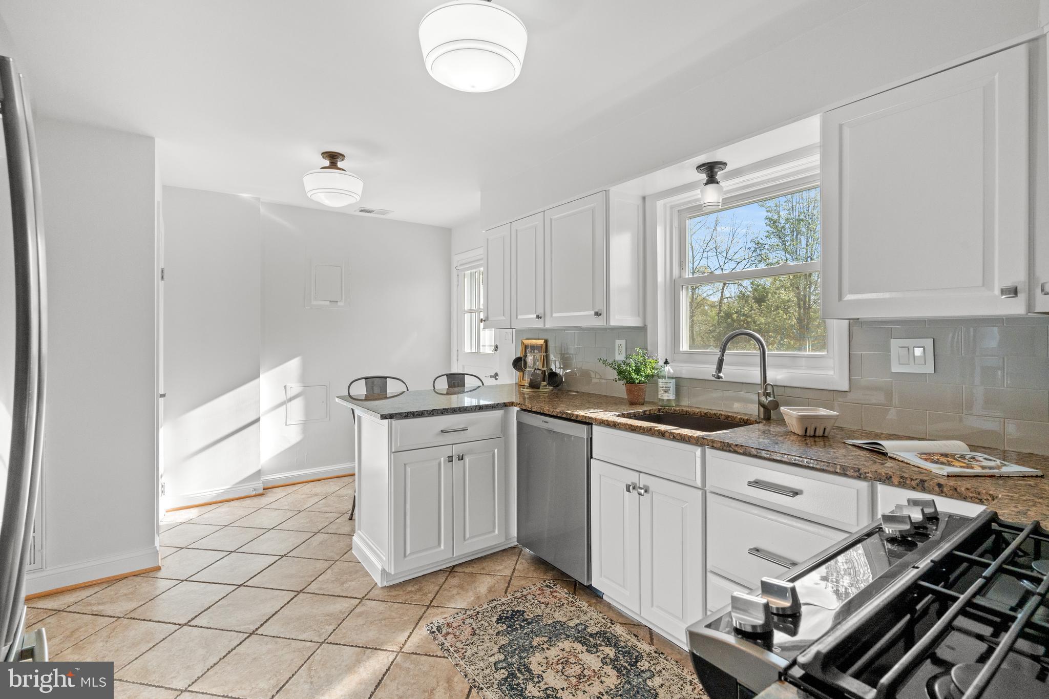 6219 Arkendale Road Alexandria, VA 22307 - Photo 10 of 33 a kitchen that has a sink and a stove in it