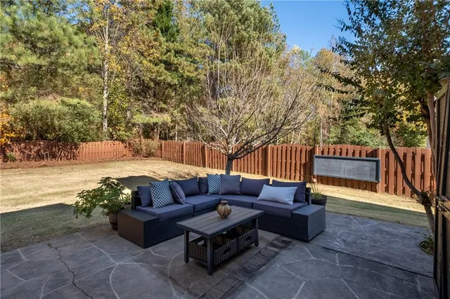 a outdoor living space with furniture and a potted plant