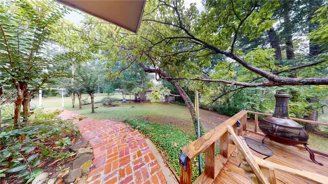a view of a backyard with sitting area