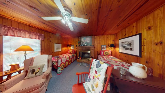 a bedroom with furniture and a chandelier