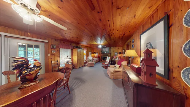 a bedroom with two beds and a chandelier