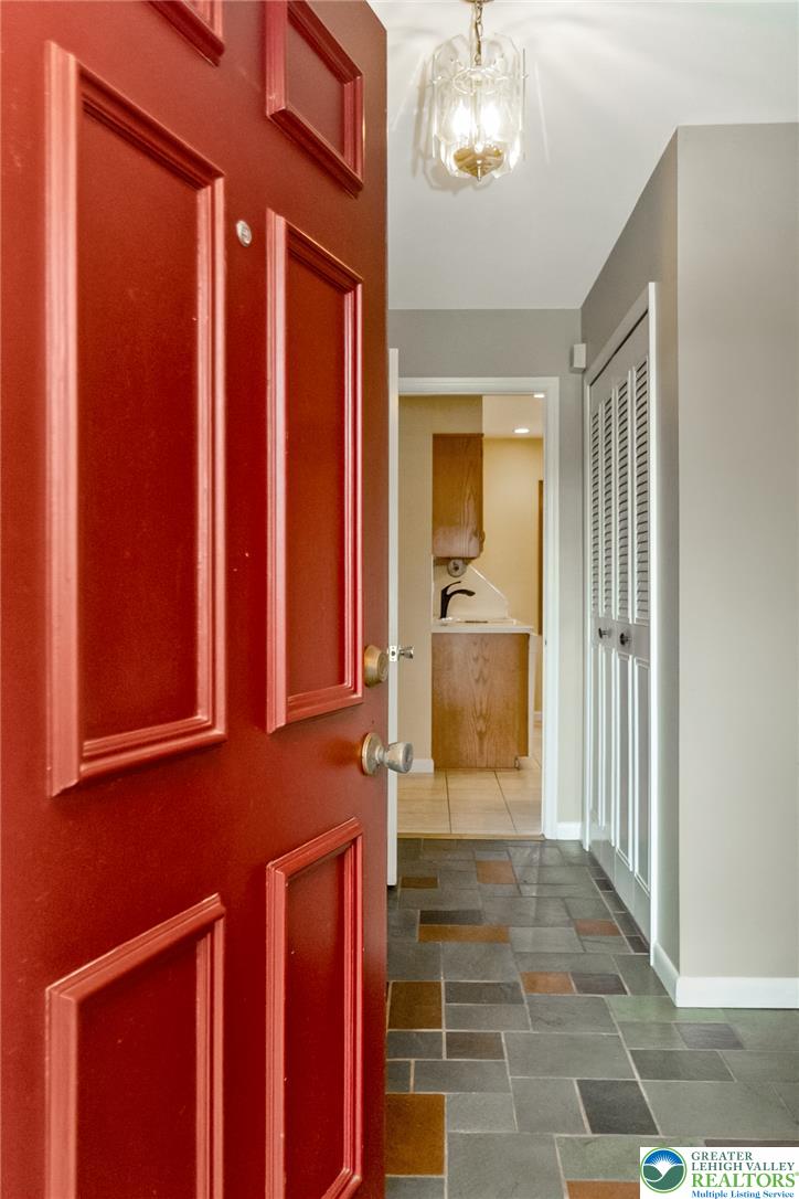 268 Apollo Drive Bethlehem, PA 18017 - Photo 2 of 56 Enter through a welcoming front door to a hallway featuring flagstone flooring.