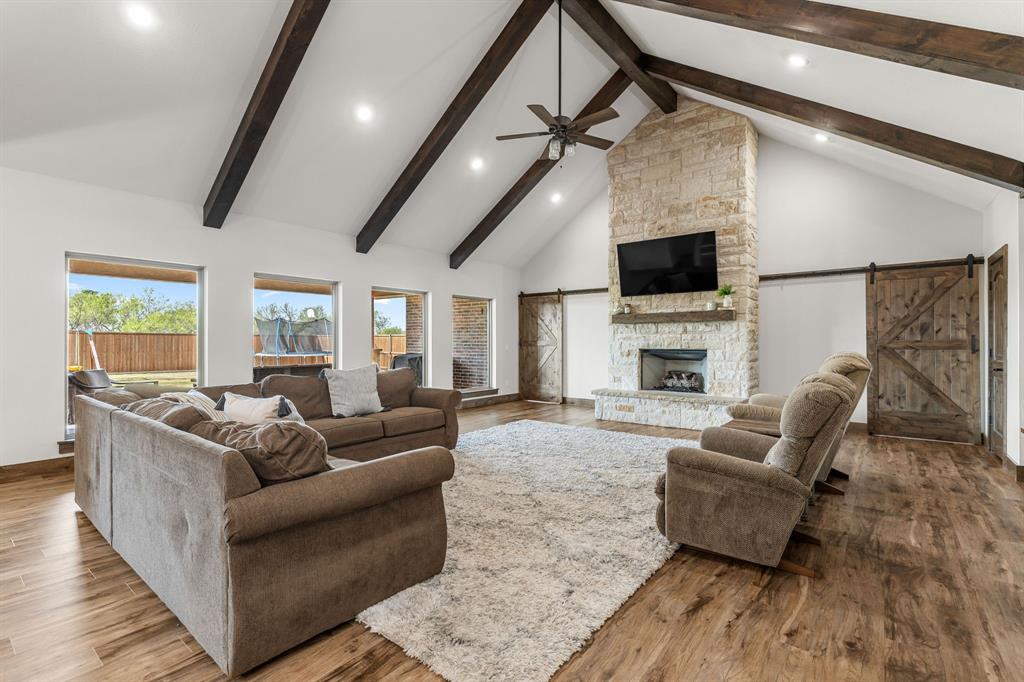 515 Sales Road Windthorst, TX 76389 - Photo 6 of 34 a living room with fireplace furniture and a flat screen tv