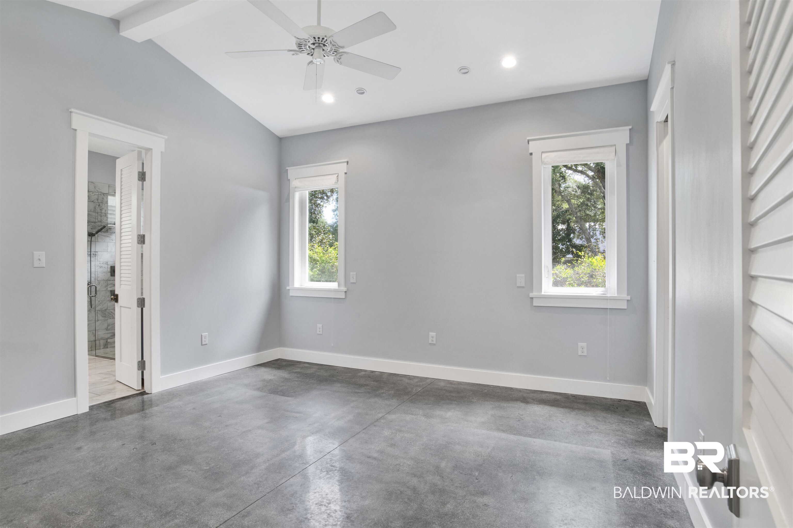 27980 Canal Road Orange Beach, AL 36561 - Photo 29 of 46 Empty room featuring finished concrete flooring, plenty of natural light, recessed lighting, and a ceiling fan