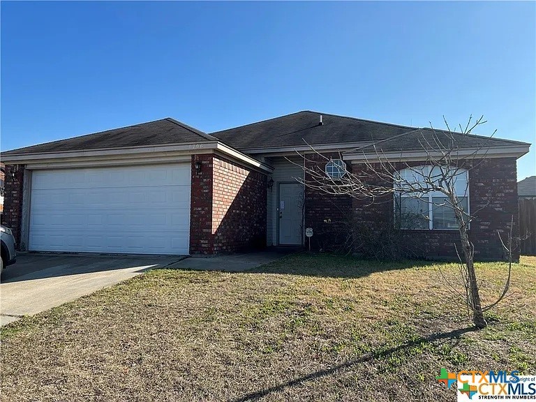 a front view of house with a yard