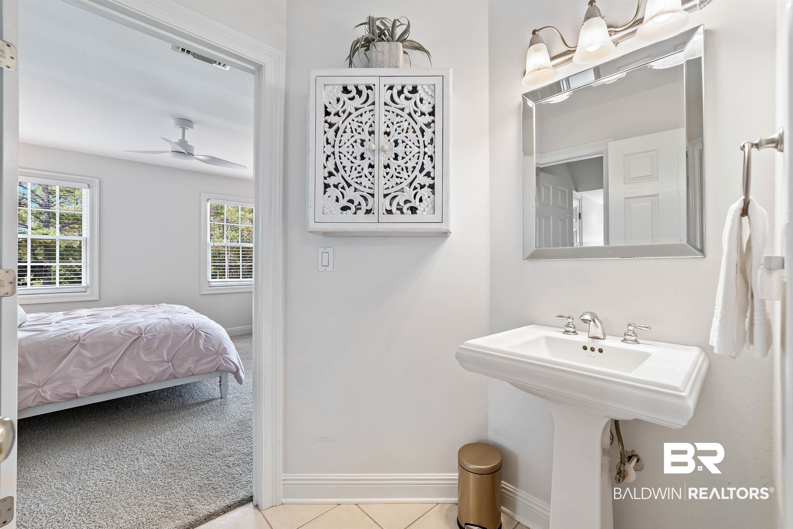 6630 East Quarry Drive Elberta, AL 36530 - Photo 29 of 63 Bathroom featuring light tile patterned floors, light carpet, and connected bathroom