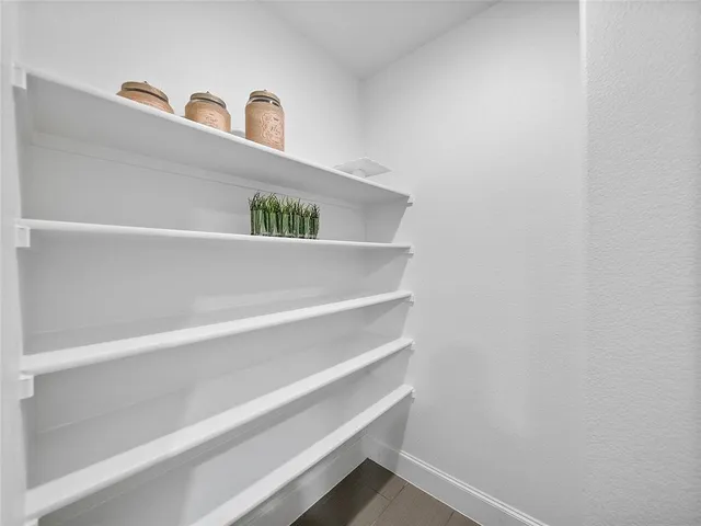 a bathroom with a sink vanity granite and toilet