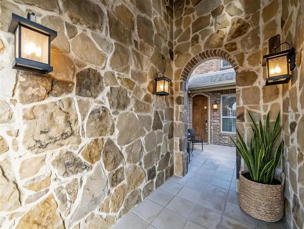 a view of a chair and table in patio of the house