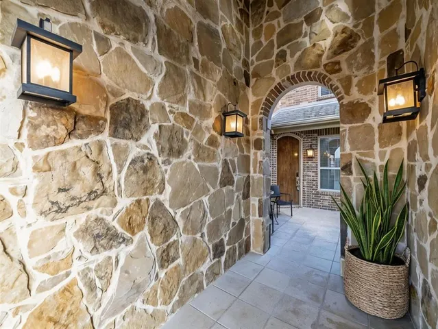 a view of a chair and table in patio of the house