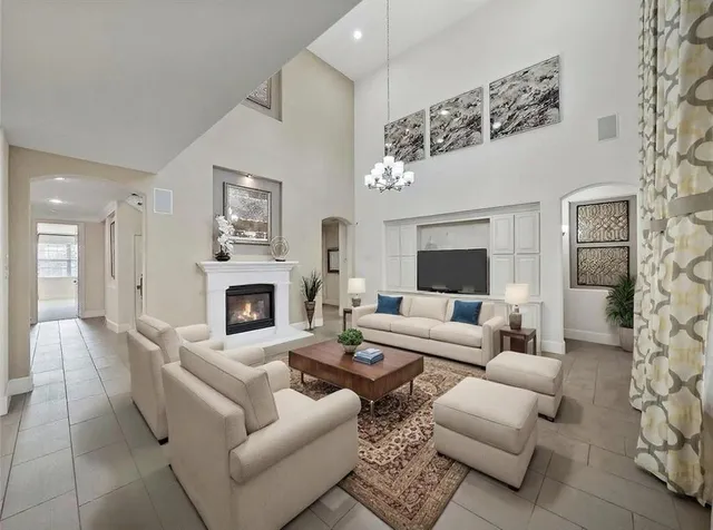 a kitchen with kitchen island granite countertop a sink and a stove top oven