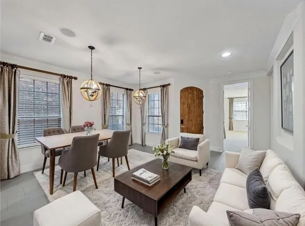 a kitchen with stainless steel appliances granite countertop a sink a stove and a refrigerator