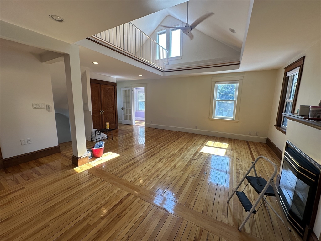 17 Herbert Road, Unit 1 Arlington, MA 02474 - Photo 9 of 26 a view of empty room with wooden floor and fan