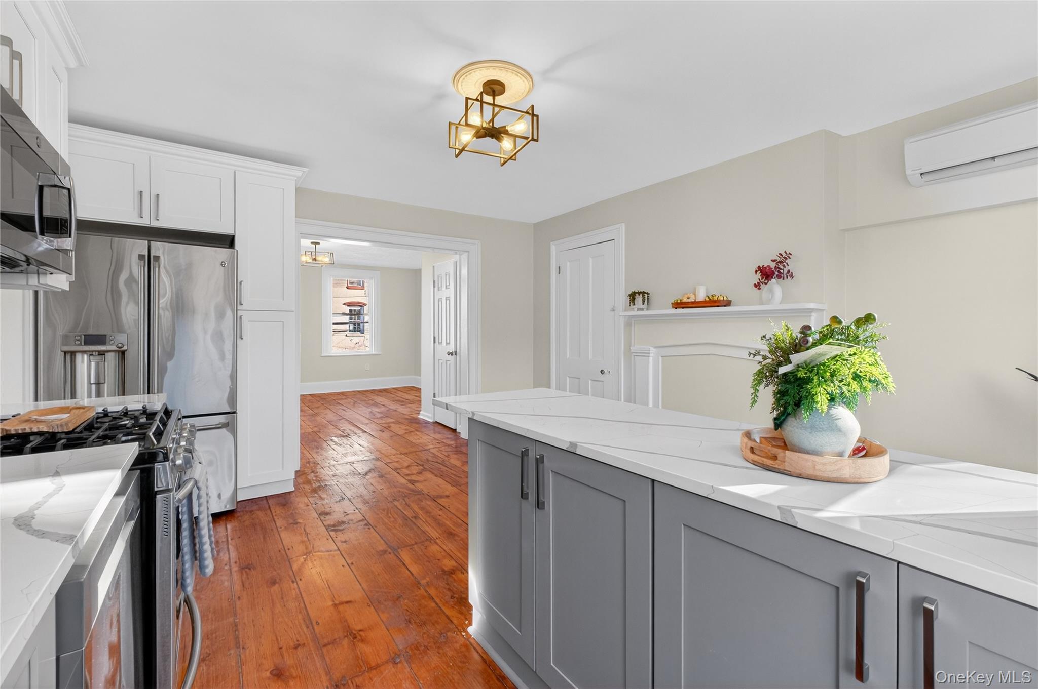 171 Chambers Street, Unit A Newburgh, NY 12550 - Photo 11 of 27 a hallway with painting and wooden floor