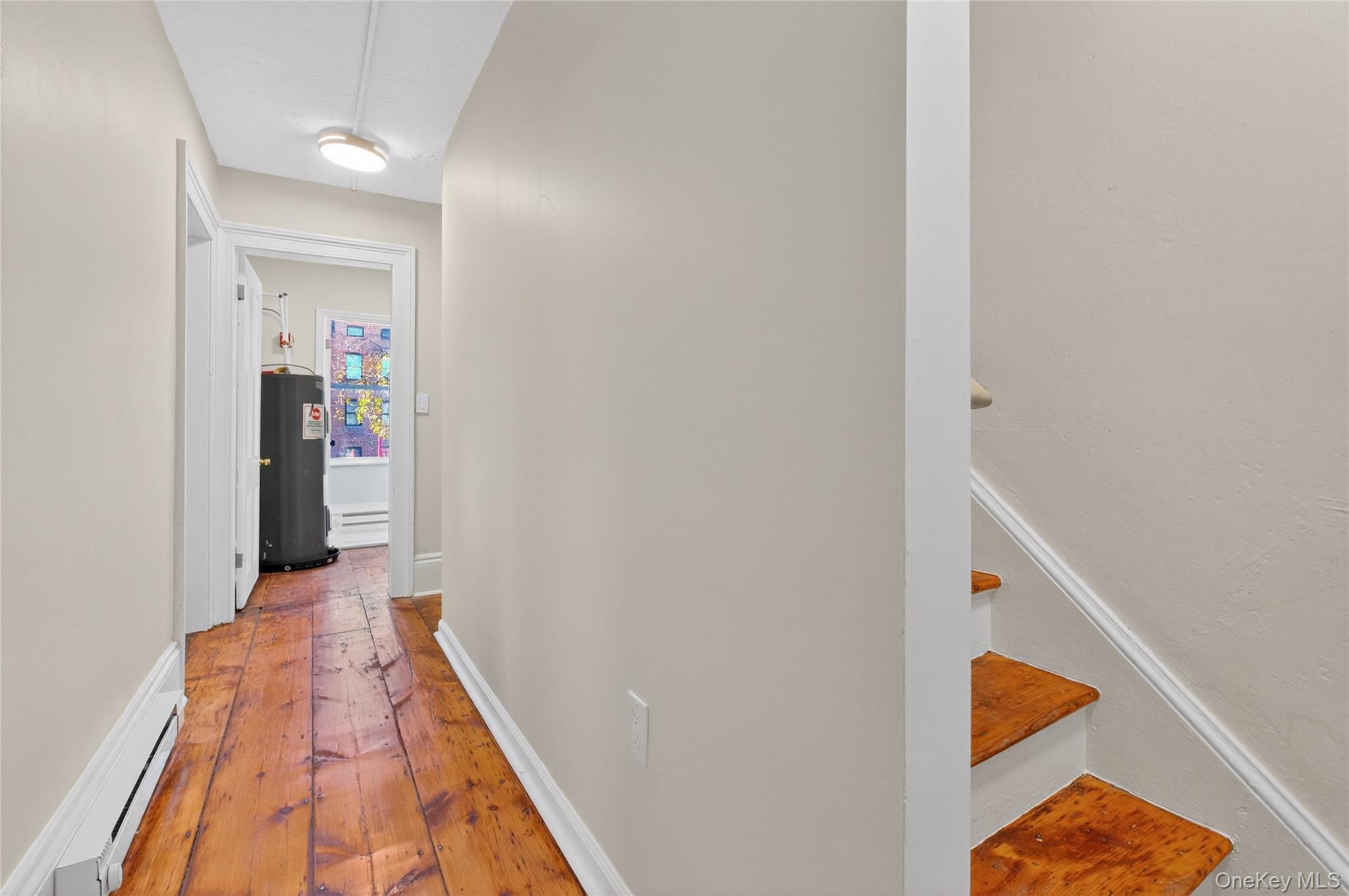 171 Chambers Street, Unit A Newburgh, NY 12550 - Photo 17 of 27 a view of a hallway with wooden floor and entryway