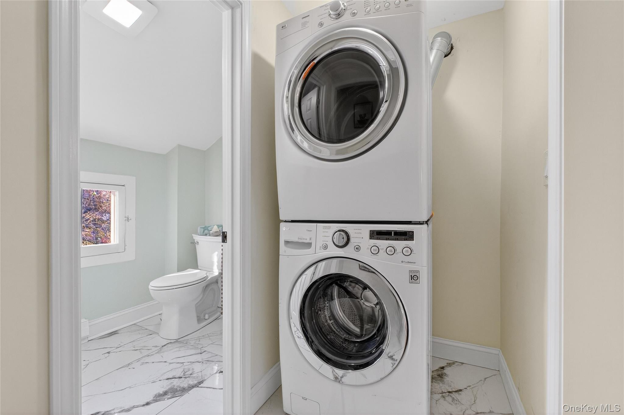 171 Chambers Street, Unit A Newburgh, NY 12550 - Photo 19 of 27 a view of a hallway with washer and dryer