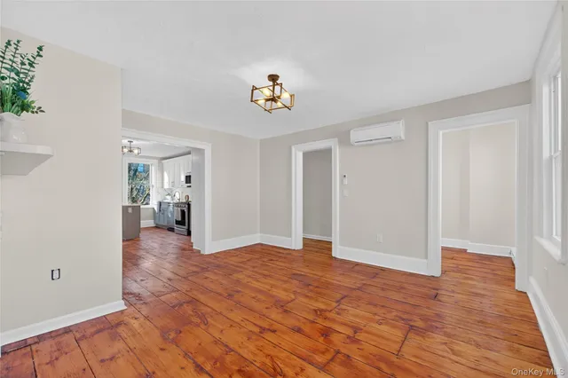 wooden floor in an empty room with a workspace