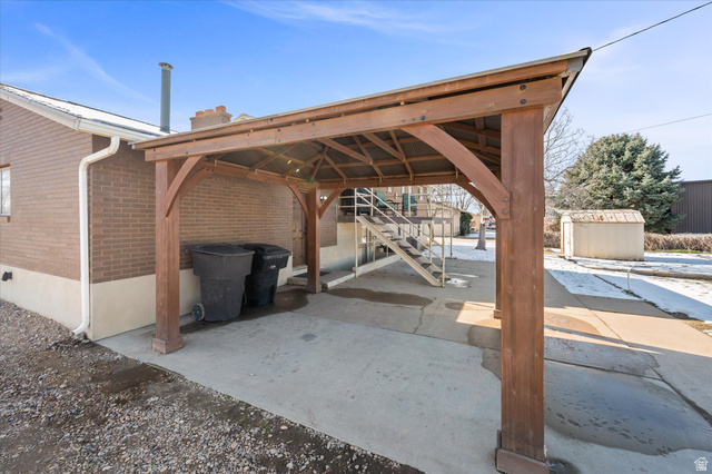 2298 West 800 North Clinton, UT 84015 - Photo 33 of 53 View of patio with a shed