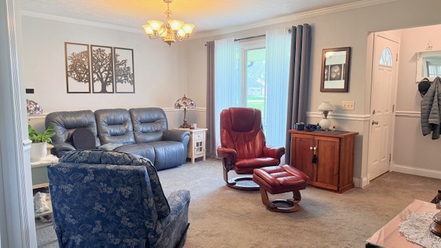 3361 Turner Drive Springfield, OH 45504 - Photo 6 of 18 This living room is a comfortable haven, complete with soft carpeting and natural light.