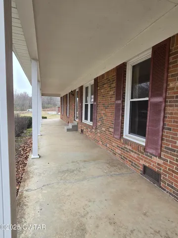 a view of a kitchen with microwave and cabinets
