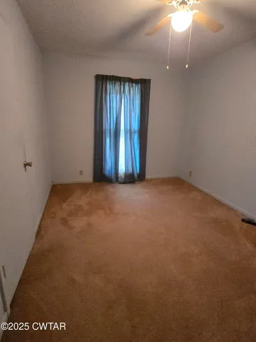 an empty room with a large window