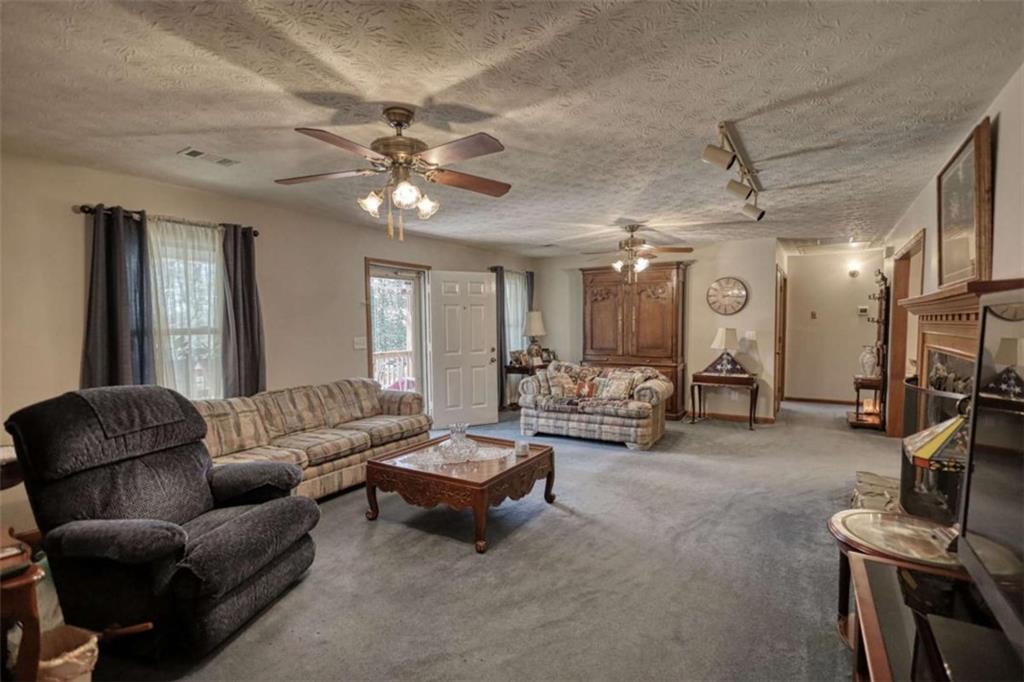 2740 Dennard Road Northeast Conyers, GA 30013 - Photo 7 of 51 a living room with furniture and a flat screen tv