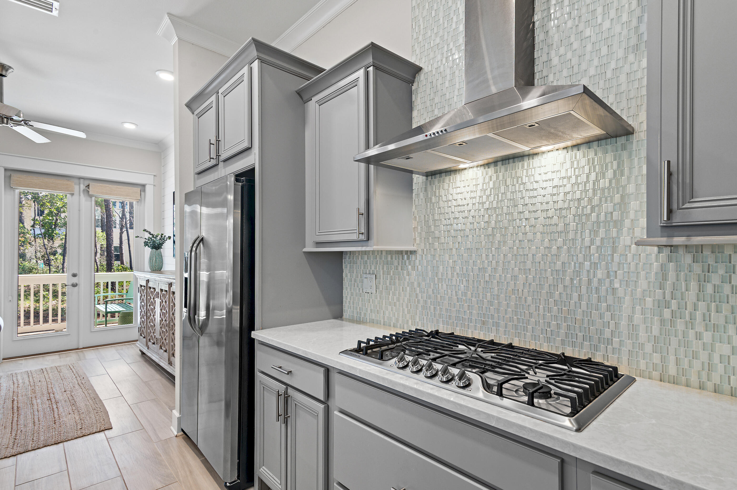 64 West W Pine, Unit A Inlet Beach, FL 32461 - Photo 12 of 61 a kitchen with stainless steel appliances granite countertop a refrigerator and a stove top oven