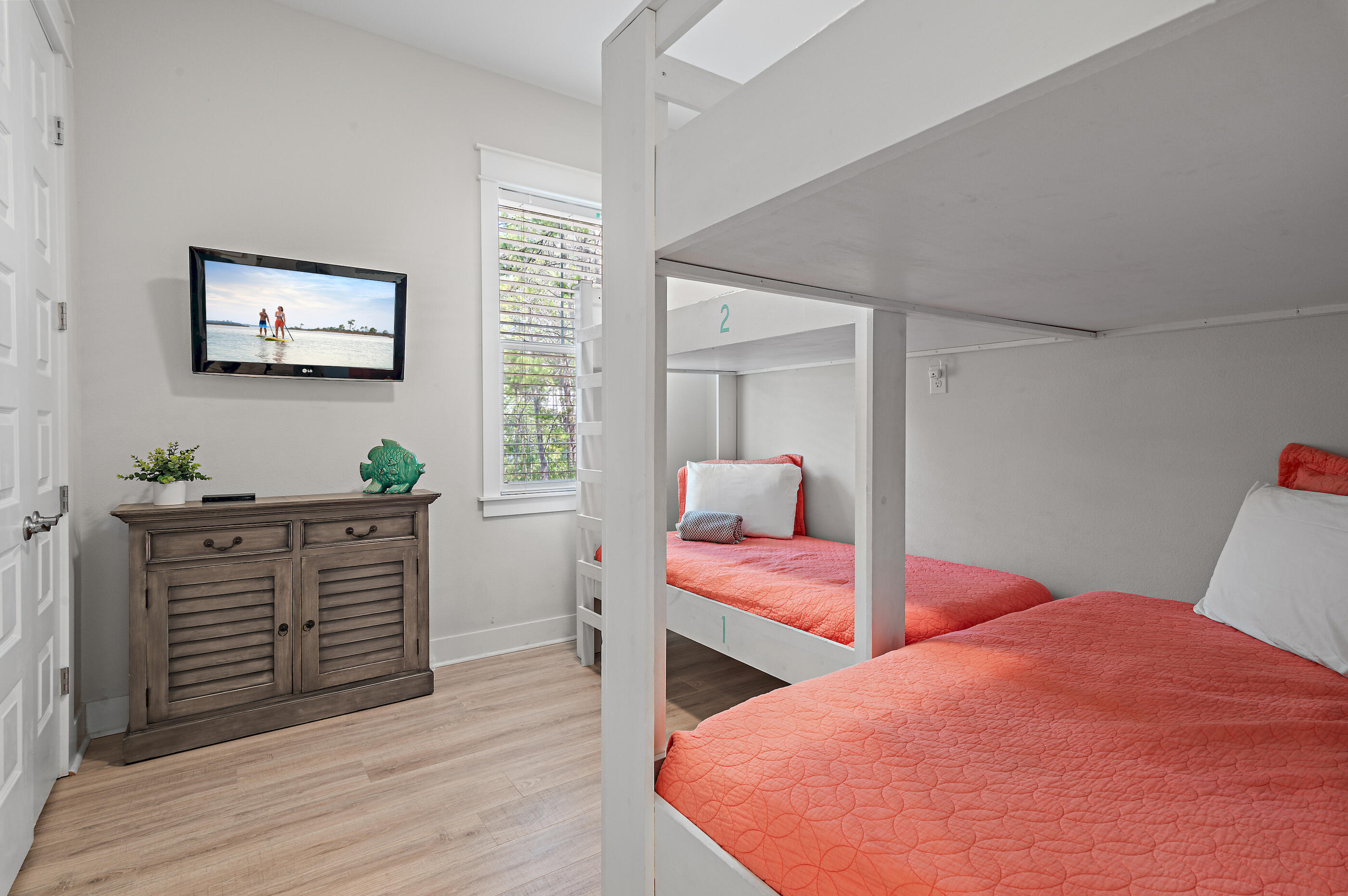 64 West W Pine, Unit A Inlet Beach, FL 32461 - Photo 17 of 61 a bedroom with furniture and a wooden floor