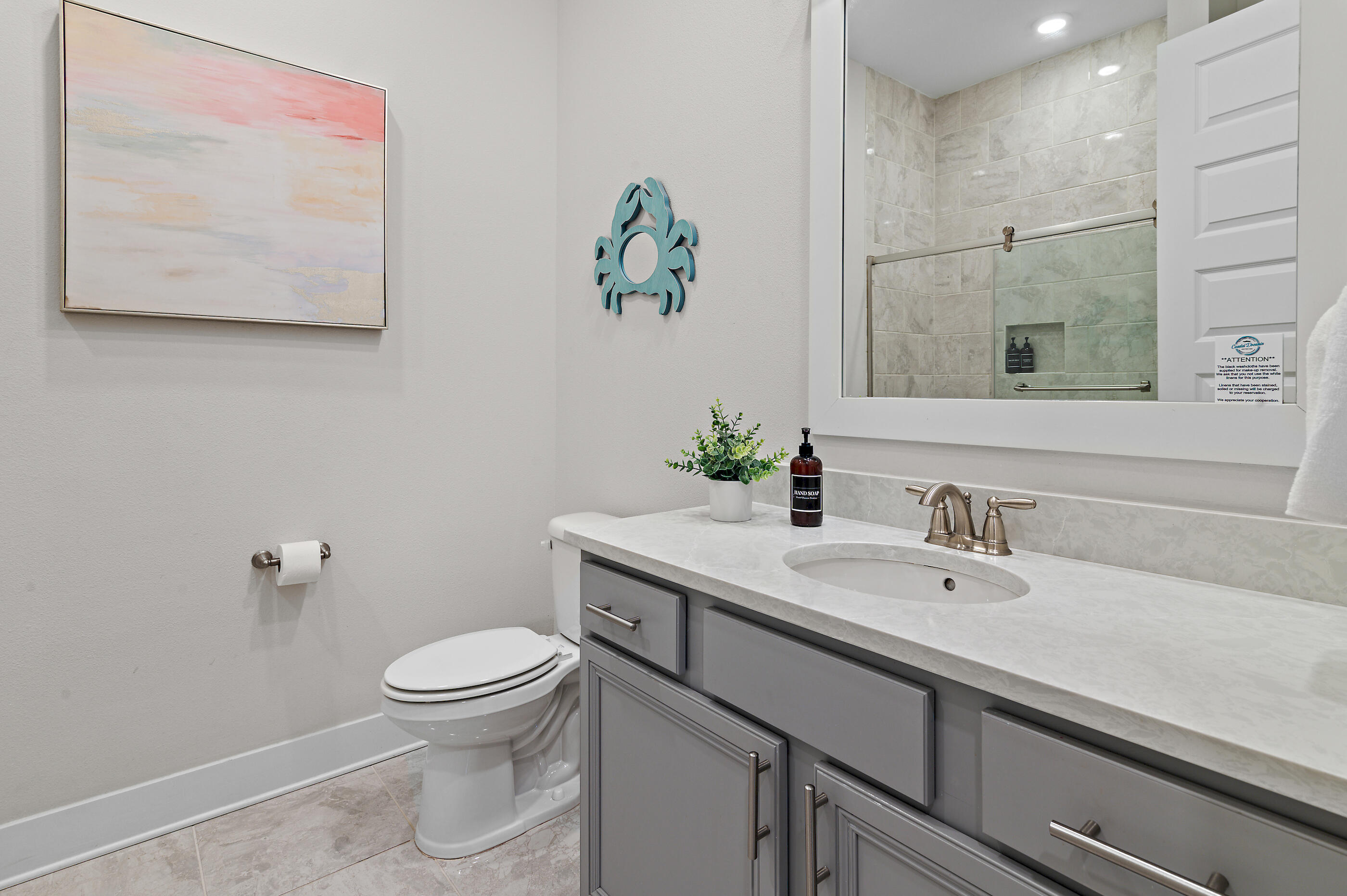 64 West W Pine, Unit A Inlet Beach, FL 32461 - Photo 18 of 61 a bathroom with a toilet sink and mirror